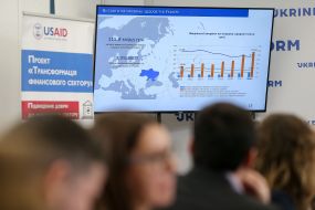 A chart on "Health care costs in Ukraine" on the screen