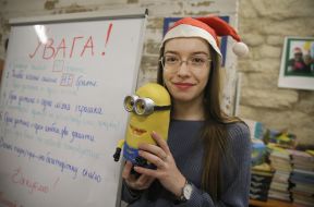 Girl holding a toy in her hands
