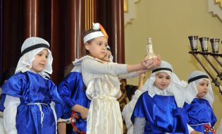 Children perform on stage
