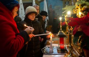 People light candles and oil lamps