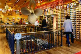Tourists buy canned sardines at a gift shop