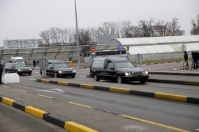 A hearse with the bodies of Ukrainians killed in a plane crash in Iran
