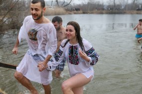 Man and woman coming out of the water