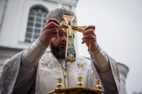 The priest consecrates water