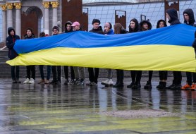 Pupils hold the flag of Ukraine