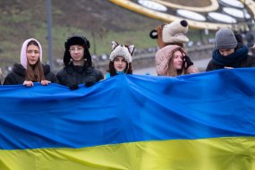 Pupils hold the flag of Ukraine