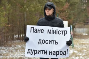 A man holds a poster