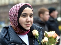 The participant of the action holds flowers