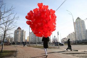 Young man with balloons