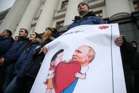 The National housing activist holds a placard