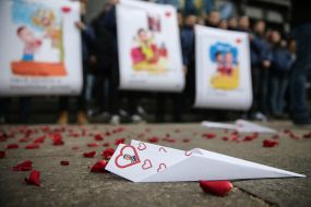 The National housing activist holds a placard