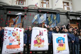 The National housing activist holds a placard