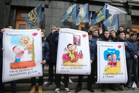 The National housing activist holds a placard