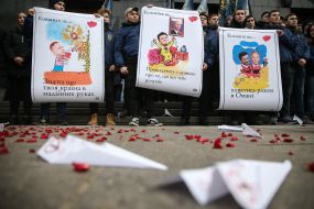 The National housing activist holds a placard