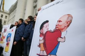 The National housing activist holds a placard