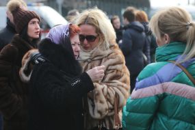 Participants of the ceremony marking the square of memory of victims of the plane crash in the sky of Iran