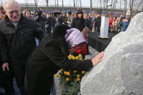 Participants of the ceremony marking the square of memory of victims of the plane crash in the sky of Iran