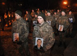 Remaut cadets holding portraits of the Heavenly Hundred Heroes