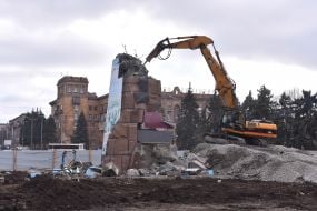 An excavator demolishes the pedestal where stood the statue of Lenin in Zaporozhye