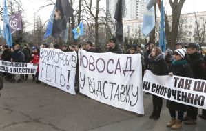 Participants of the action hold a poster