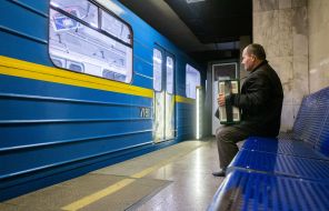 A man plays the accordion at one of the subway stations