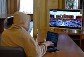 Journalists watching a broadcast of the meeting of the Verkhovna Rada
