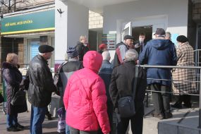 People queuing near the Savings Bank branch