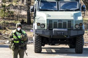 The checkpoint police in conjunction with the national guard at the entrance to Kiev
