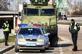 The checkpoint police in conjunction with the national guard at the entrance to Kiev
