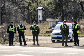 The checkpoint police in conjunction with the national guard at the entrance to Kiev