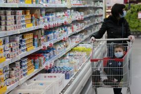 Customers buy products in a supermarket in Kiev