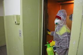 Disinfection entrance of a residential building in Kiev