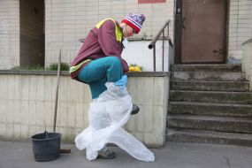 A utility worker drops a protective suit
