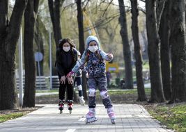 Woman with baby roller skating