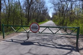 Fenced off road and stop sign at the entrance to Khortytsya Island