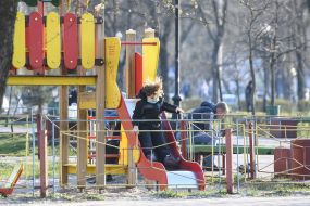 The boy descends from the slide at the playground in Kiev