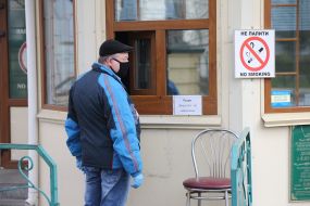 Man in medical mask at the entrance to Kiev-Pechersk Lavra