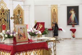 The parishioner is kneeling at St. Basil the Great Temple
