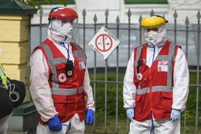 Ambulance workers in protective suits