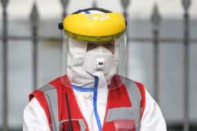 Ambulance worker in protective suit