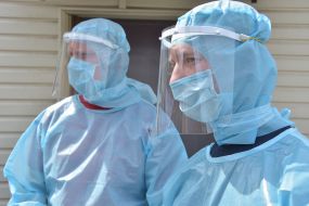 Doctors in protective suits