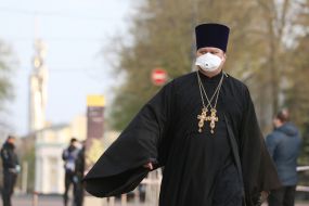 Priest in a medical mask