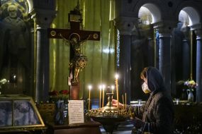 Believer puts a candle