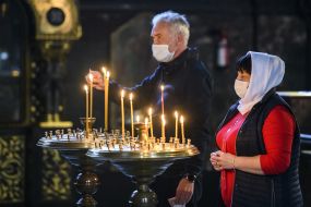 Believer puts a candle