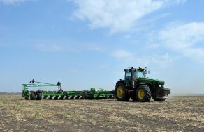 Tractor sowing sunflower seeds