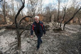 Man at the fire in the town of woodlands in the exclusion zone