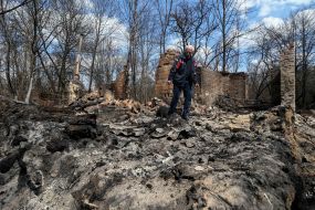 Man at the fire in the town of woodlands in the exclusion zone