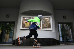 A boy riding on roller skates