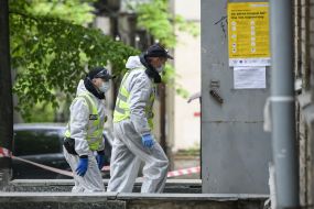 Law enforcement officers near the hostel