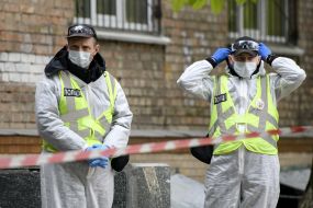 Law enforcement officers near the hostel